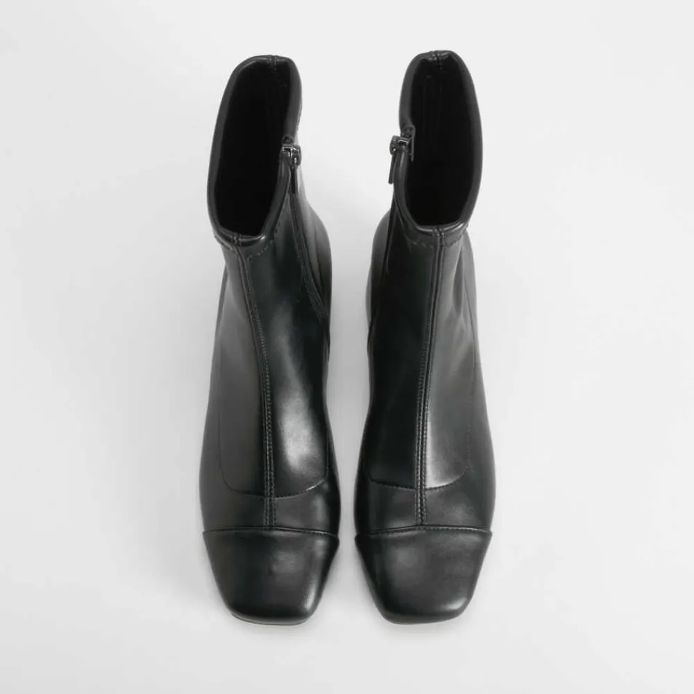 botn_tacn_puntera_negro_p_SKUKcLpwnskuN_1.webp New Botín tacón puntera negro PICCOLA PIU Mujer Botines Tacón